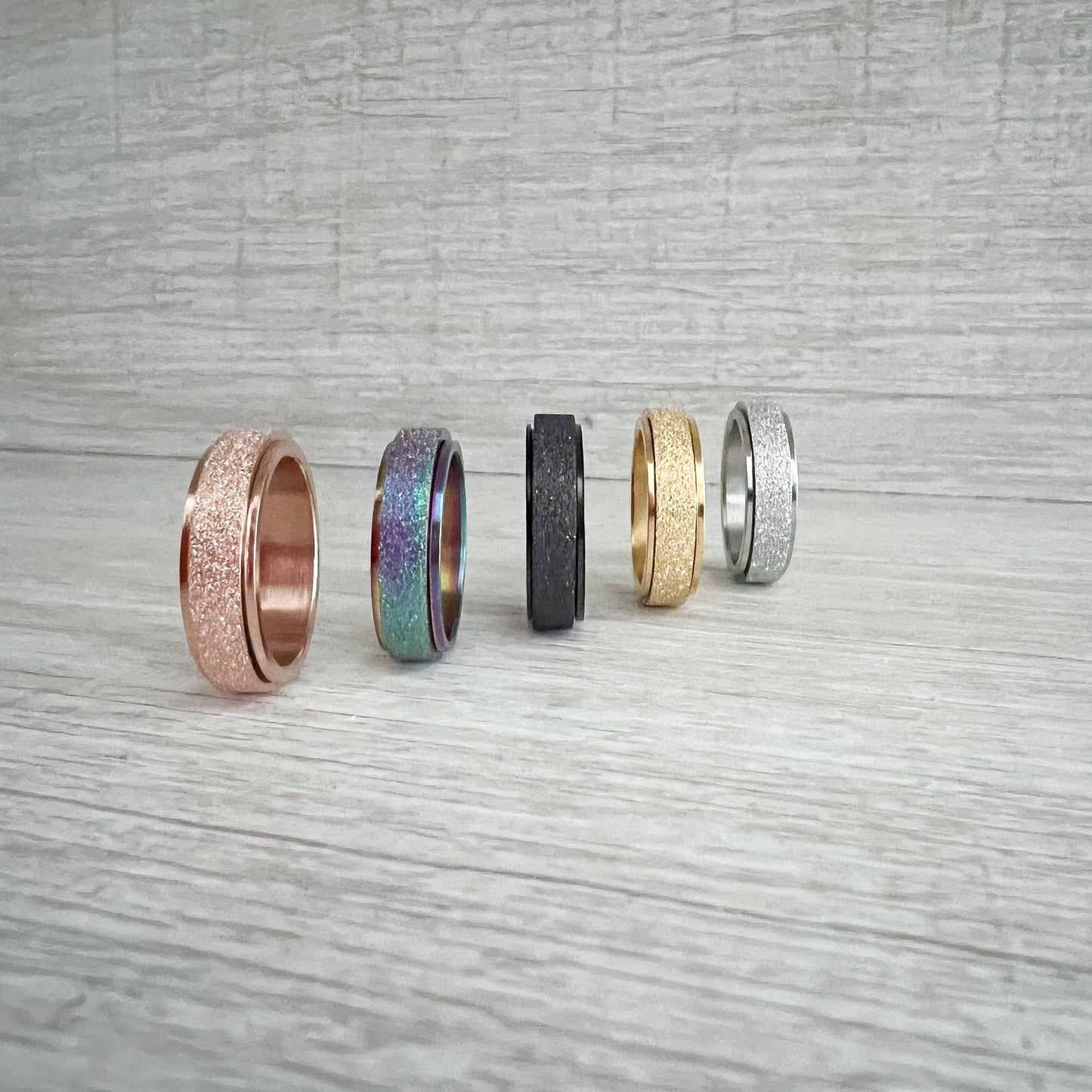 Stainless Steel Spinner Rings (gold size 6) - Agricola Street Books
