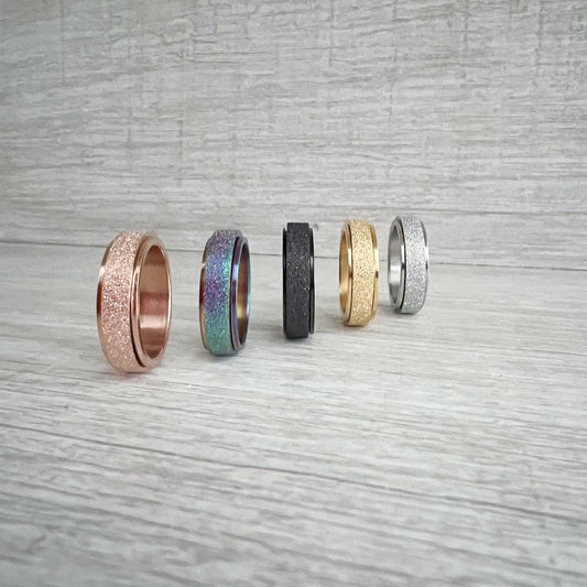 Stainless Steel Spinner Rings (gold size 6) - Agricola Street Books