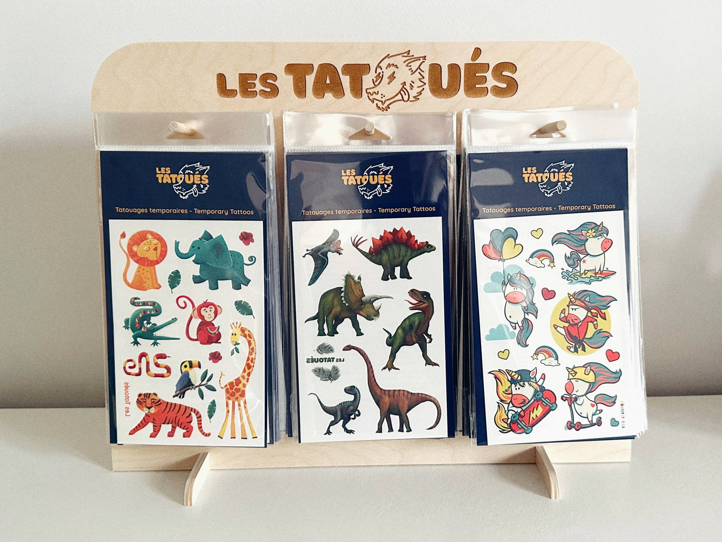 Les Tatoués - Our wood display. - Agricola Street Books