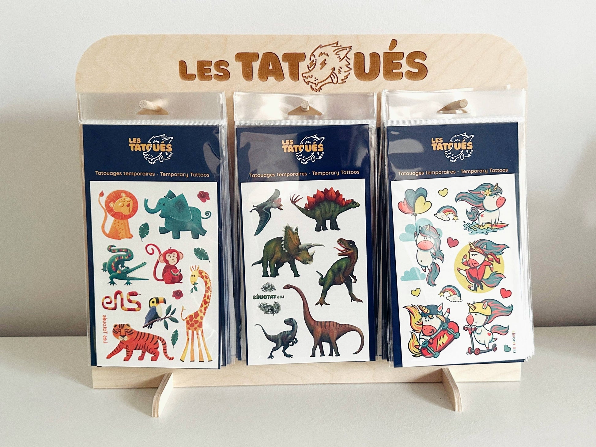 Les Tatoués - Our wood display. - Agricola Street Books
